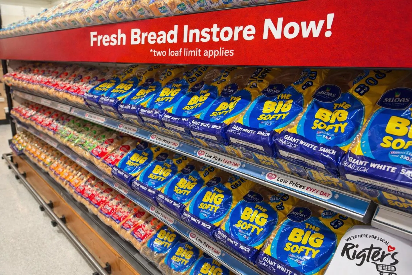 A photo of shelves of bread generated by artificial intelligence. The text at the top says 'Fresh Bread Instore Now!' with a tagline that says '*two loaf limit applies'