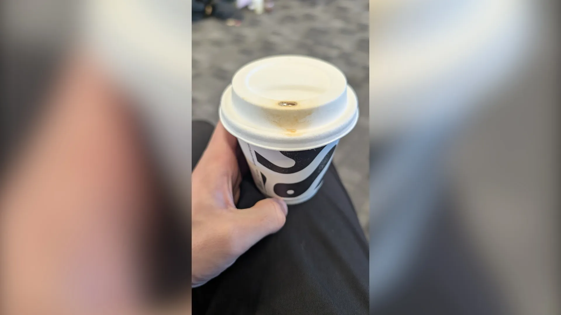 A photo of a takeaway cup of coffee.